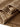 Olvaxe Snow Washed Kids T-Shirt, Inner and outer hem construction — official garment detail photo; warm-brown appearance reference, not an explicitly labeled Coffee dye